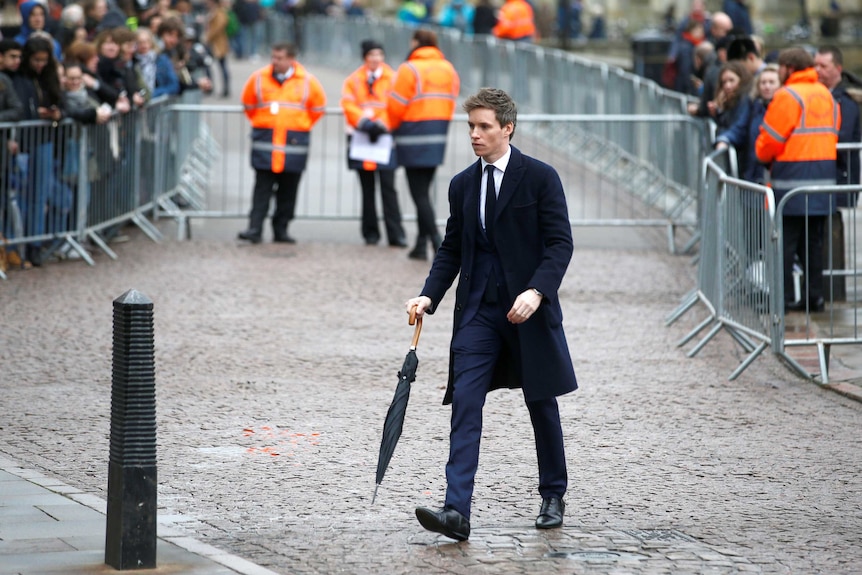 British Actor Eddie Redmayne arrives at the funeral in Cambridge.