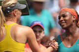 Serena Williams (R) shakes hands with Russian Maria Sharapova after her win in Florida in 2014.
