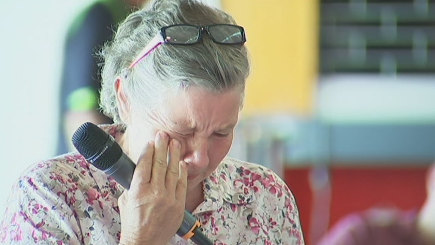 A woman breaks down during a meeting of the Rural Debt and Drought Taskforce