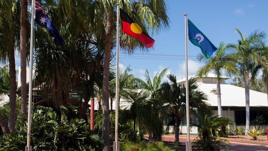 Flags fly outside the Broome shire offices.