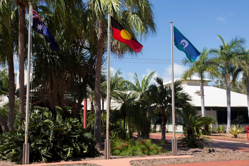 Flags fly outside the Broome shire offices.