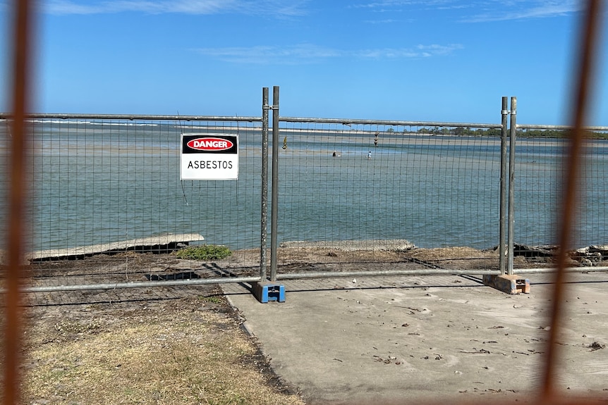 Asbestos warning signs at a beach.