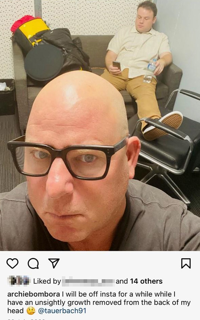 A screenshot of an Instagram post. One man is near the camera, another is behind him.