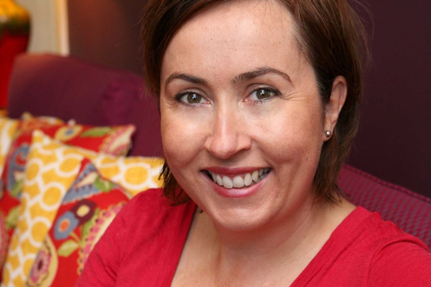 woman in red shirt smiling