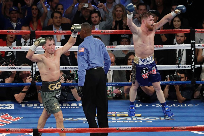 Canelo Alvarez and Gennady Golovkin both raise their arms in the ring after their drawn world middleweight bout.