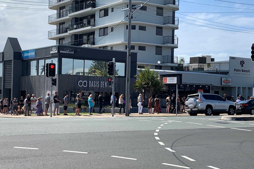 A long line of people on a street