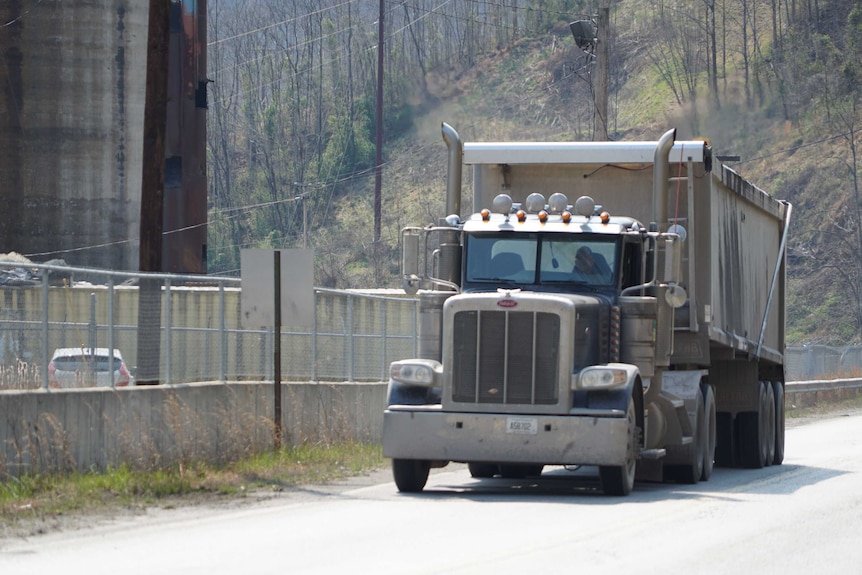 A coal truck drives along the highway near logan in west virginia.