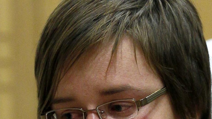 Els Clottemans listens to the verdict at the end of her trial
