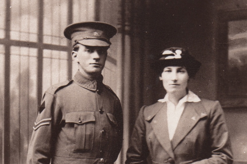 Photo from early 1900s of a soldier standing next to his wife on their wedding day