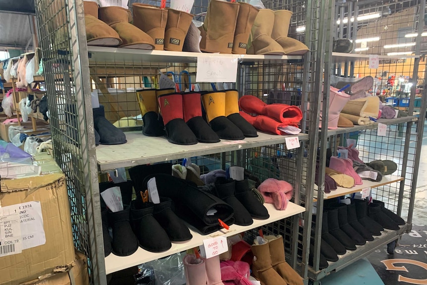 Factory rack holding various coloured ugg boots