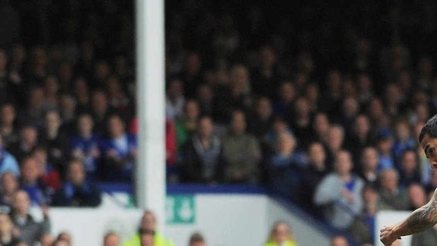 Merseyside magic: Tim Cahill opens the scoring for Everton.