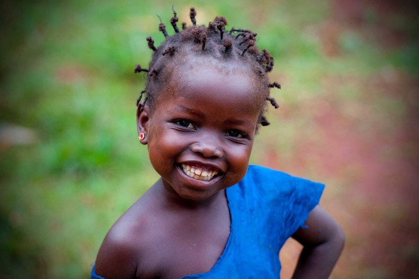 A girl smiles in the Central African Repbluc