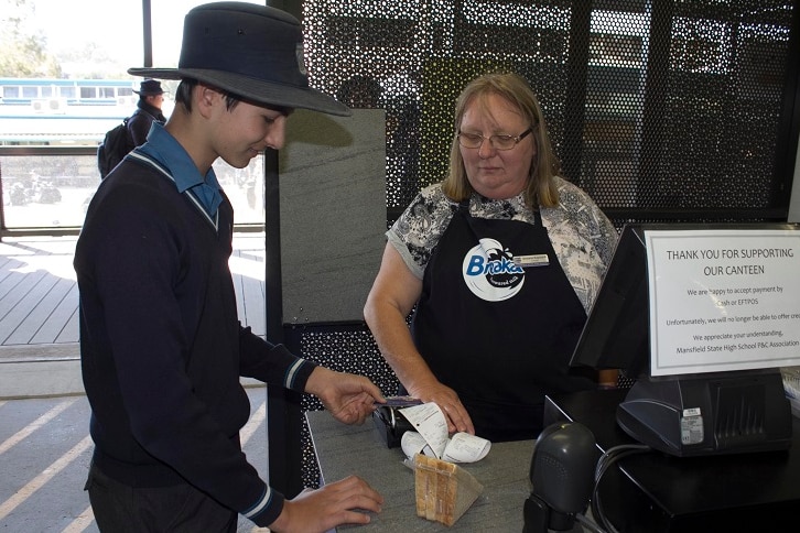 Mansfield State High School tuckshop lady Sharene Rapisardi with year nine student Jayden Liu-Batista at the canteen.