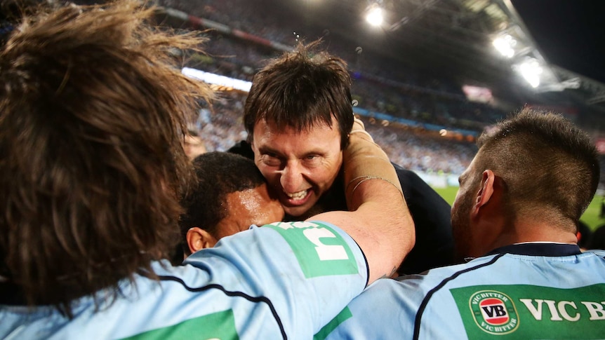 Sweet feeling ... Blues coach Laurie Daley celebrates with his players