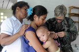 Kiribati infant being treated
