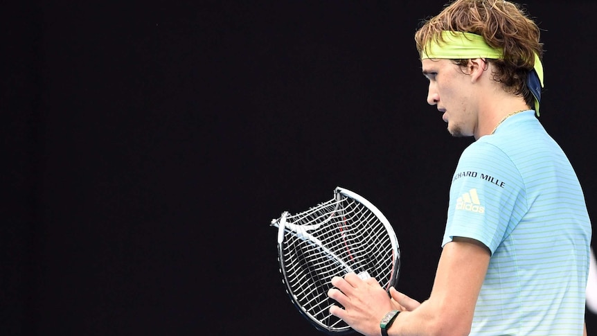 Zverev looks on with his destroyed racquet at Australian Open