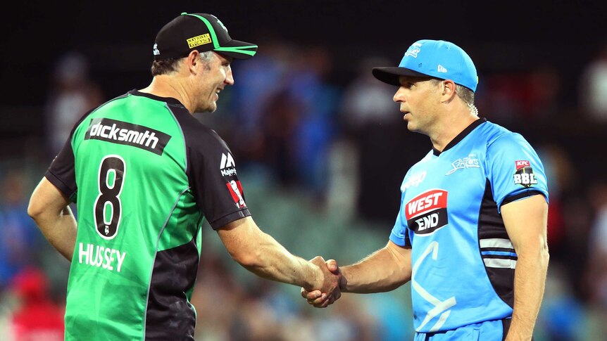 Room for improvement ... Brad Hodge shakes hands with his Stars counterpart David Hussey
