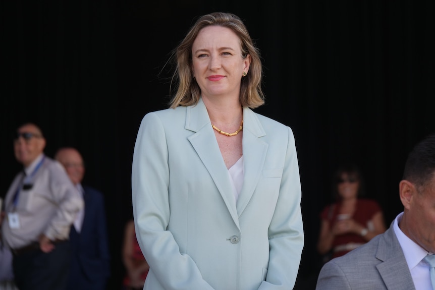 woman in suit smiling