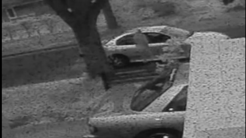 A car pulls up alongside two women.