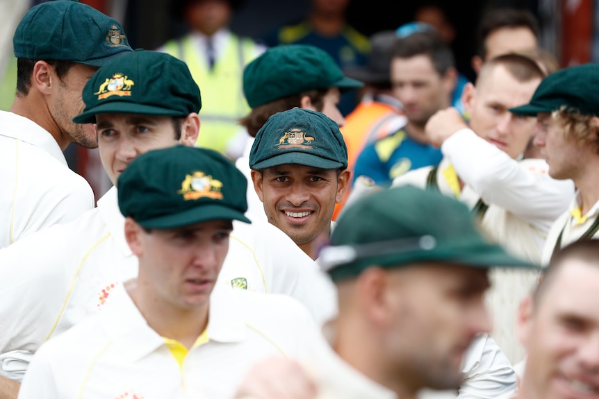 Cricketer Usman Khawaja standing amongst the 2019 Australian Test team before a match