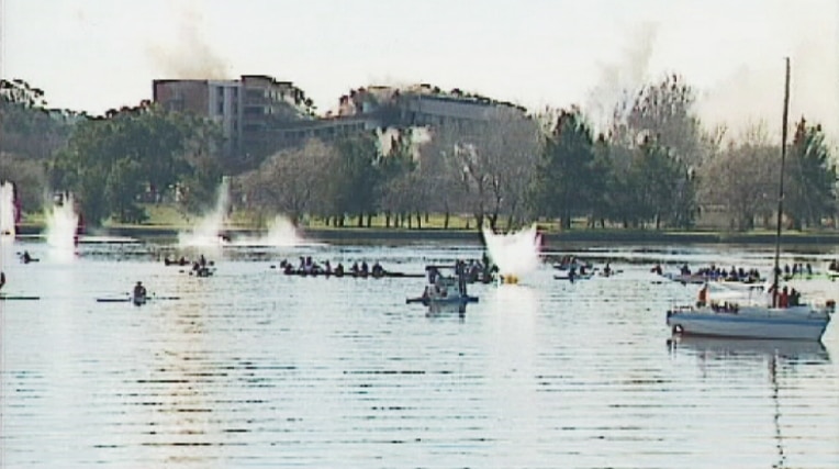 The Royal Canberra Hospital throws debris into Lake Burley Griffin during a scheduled implosion in 1997.