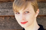 Chelsea Manning looks at the camera.