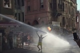 Turkish police blast a protester with a water cannon