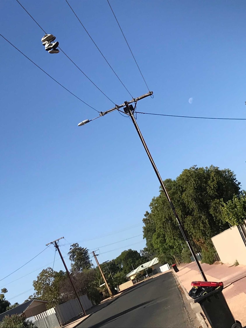 Sneakers strung over powerlines.