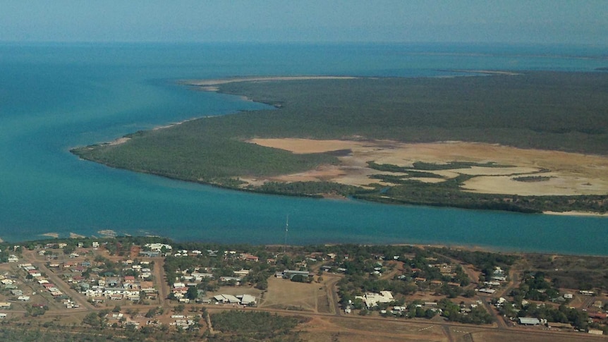 Aerial view of Mornington Island showing the land, water surrounding the island and houses.