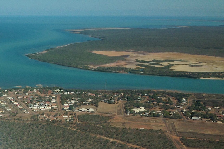 Aerial view of Mornington Island showing the land, water surrounding the island and houses.
