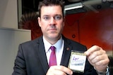 WA Upper House Liberal MP Phil Edman holding sample of synthetic cannabis