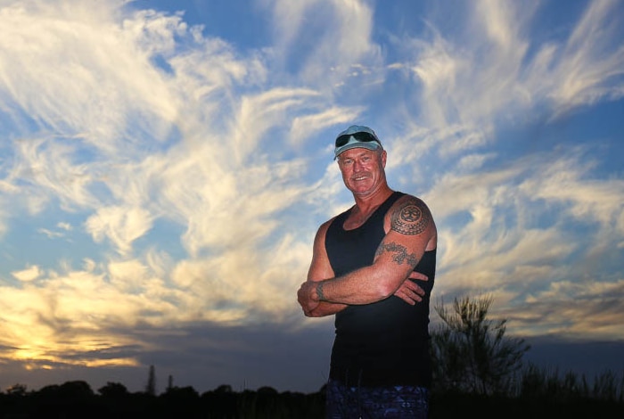 Michael Williams with cloudy sky in background