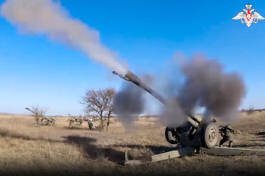A Russian army 122-mm howitzers D-30 fires at a Ukrainian position.