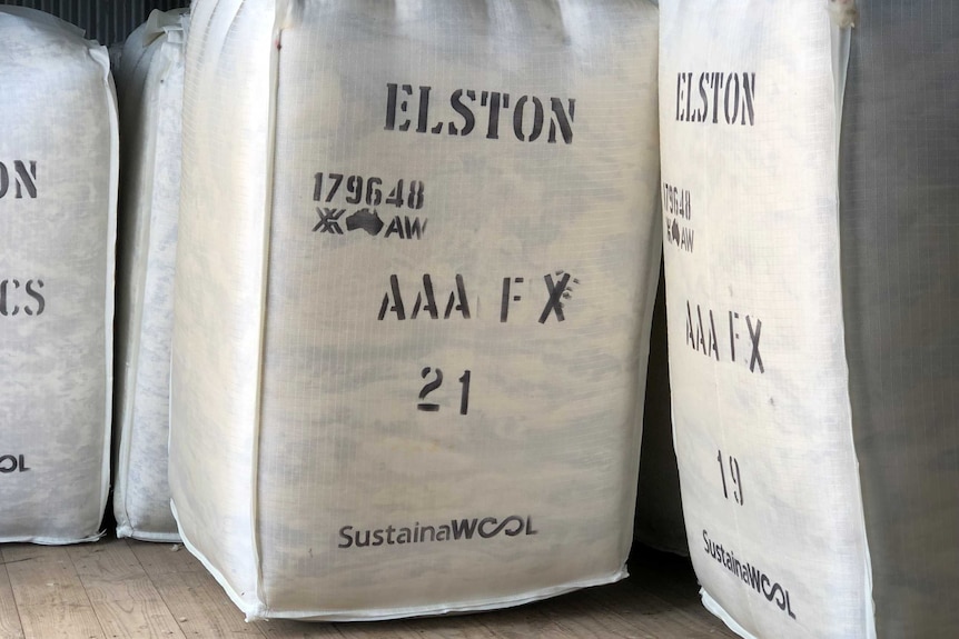 large rectangular cubes of wool are marked with a "SUSTAINA-WOOL" logo