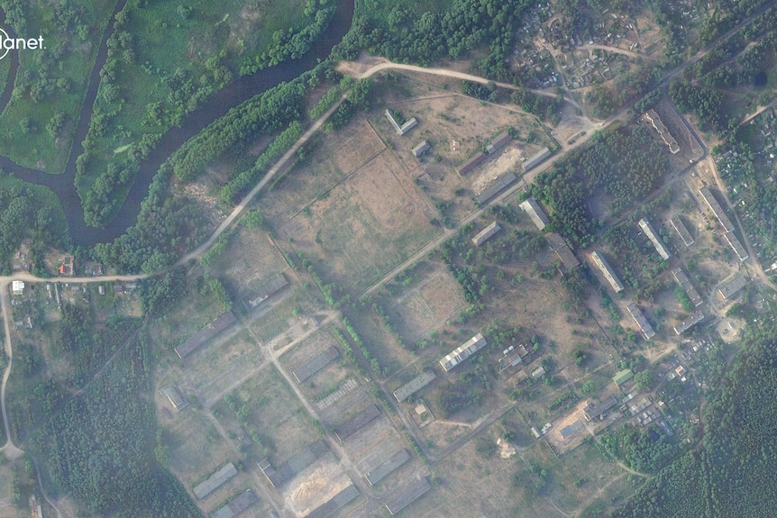 A satellite view of former military base in Belarus showing little development compared to new buildings in later image.