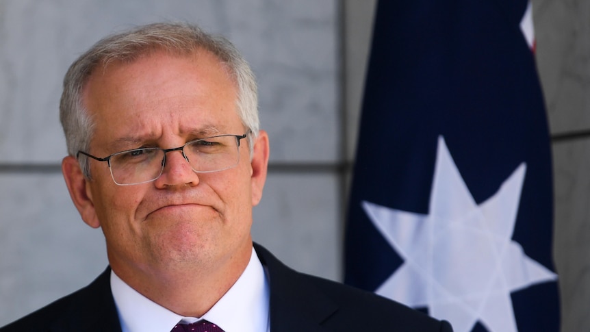 A medium close up shot of the Prime Minister speaking during a press conference