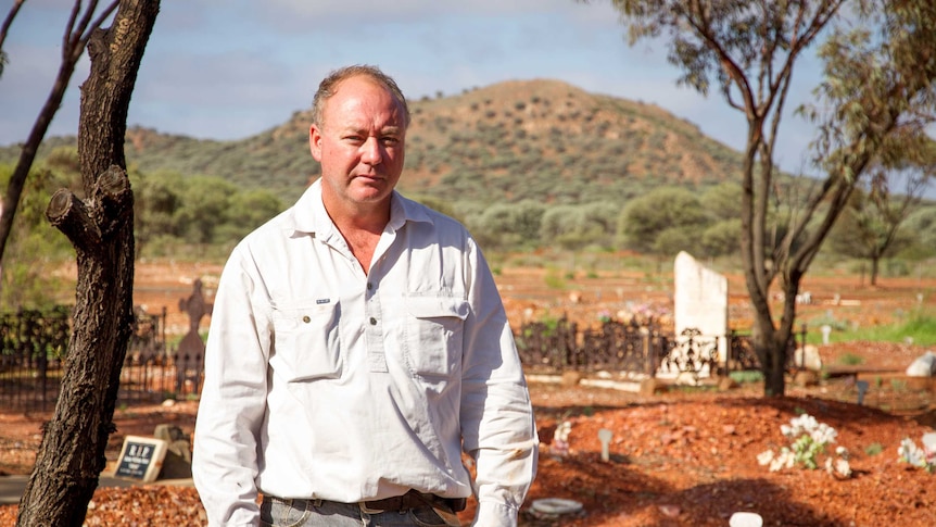 Matt Taylor stands in the Leonora cemetery