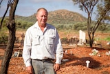 Matt Taylor stands in the Leonora cemetery