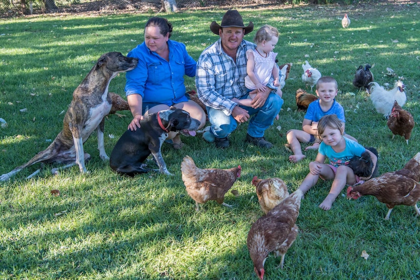 The children at Jubilee Downs station and parents showing off their chickens.