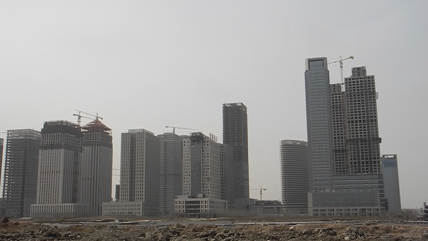 A row of tall apartment and office towers are under construction in Yujiapu, China's Manhattan-inspired ghost city.