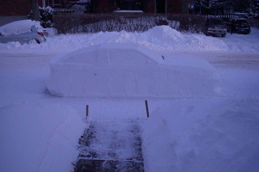 A car made out of snow on a street in Montreal, Canada.