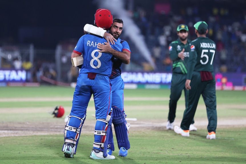 Rahmat Shah and Hashmatullah Shahidi hug at the crease after hitting the winning runs