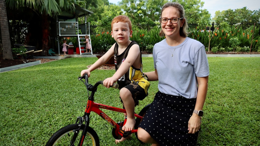 Elizabeth Adamson and her son Jake in their backyard in Darwin.