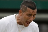Nick Kyrgios yells out during his match against Milos Raonic at Wimbledon.