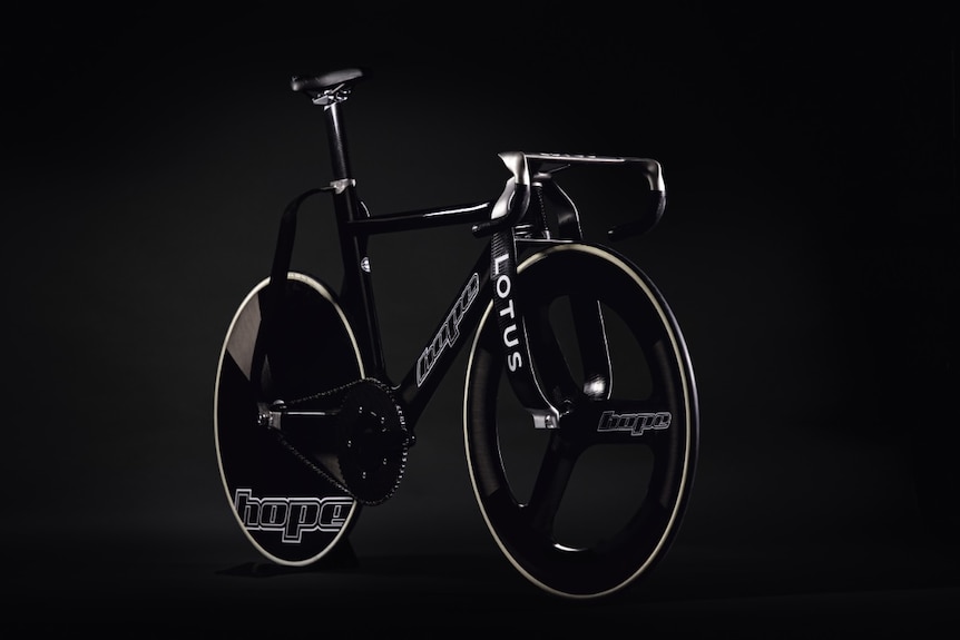 An angled shot of a black track bicycle with Lotus and Hope written on it