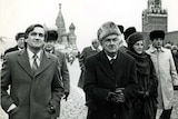 Hawke and wife Hazel in fur hats walking with Cassidy beside him.