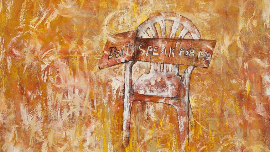 A painting shows a chair in the outback with a sign that reads 'don't speak for me'