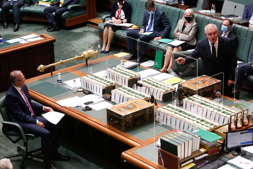 Scott Morrison points towards Anthony Albanese in the House of Representatives. 