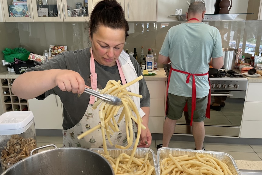 A woman preparing food in a kitchen