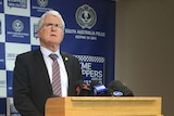 SA Major Crimes Superintendent Des Bray stands at a podium